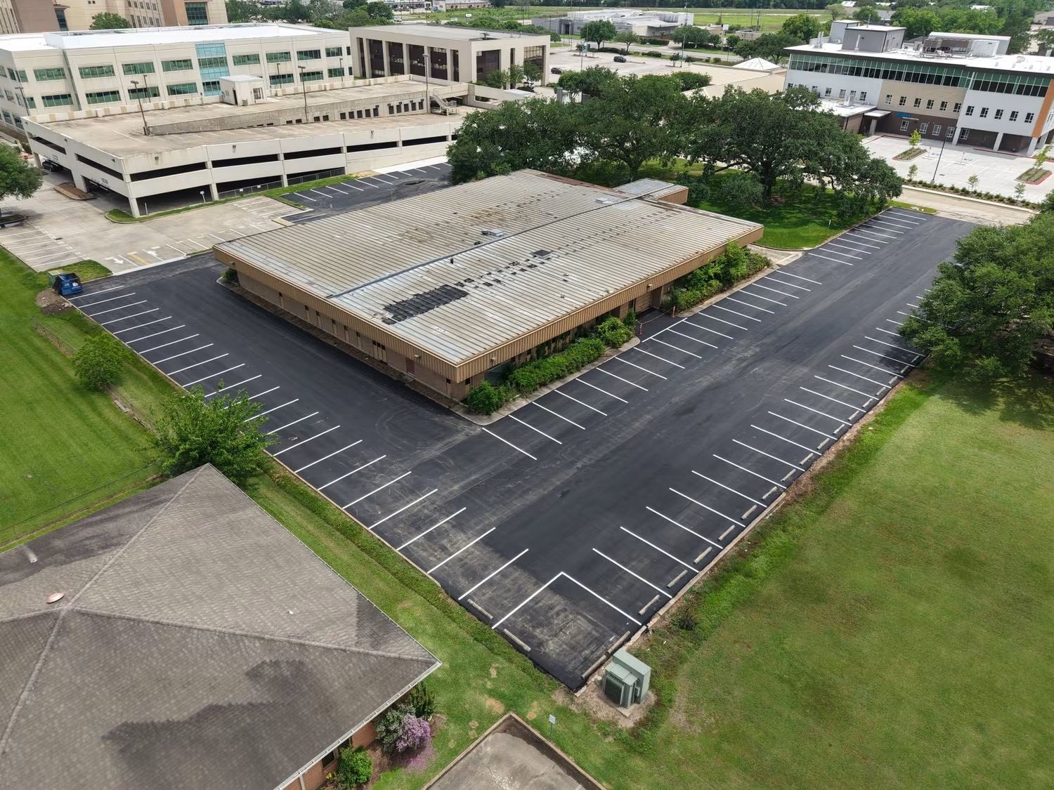 Aerial view of a freshly striped commercial parking lot